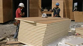 Two men at a construction site